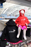 cockburn ice arena branded hoodie with small penguin and polar bear logos in red and black colours