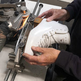 Close up of Risport RF3 ice skates being sharpened by coach David Reynolds.